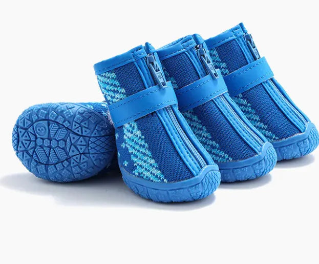 Blue pet boots with zippers on a white background