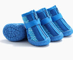 Blue pet boots with zippers on a white background