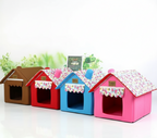 Four colorful pet houses with floral roofs on a white background
